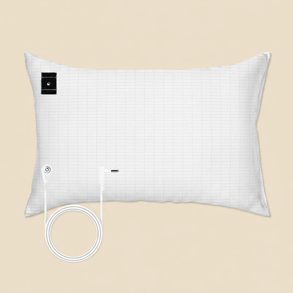 White pillow with grid pattern on a light sand colored background